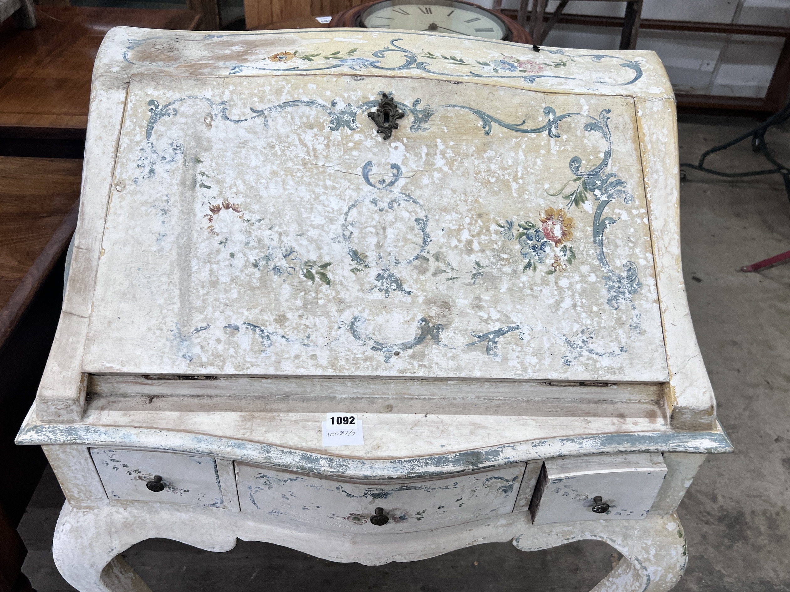 An Italian style painted serpentine front bureau, width 75cm, depth 46cm, height 102cm